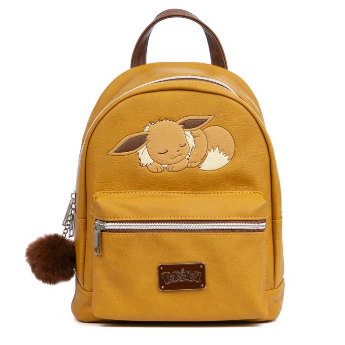 DAM Sac à dos Ocre Pokémon Premium. Compartiment principal spacieux avec poche avant et arrière. Avec accessoire pompon 24x17 5x28Cm