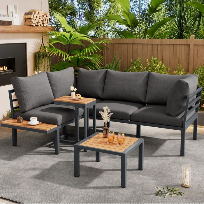 Salon bas de jardin avec canapé dangle table dappoint et table basse pouf en acier galvanisé gris et noir