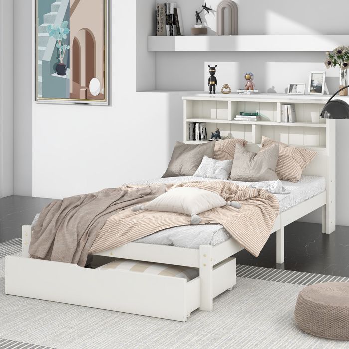 Lit simple blanc en bois massif avec tiroirs et tête de lit bibliothèque
