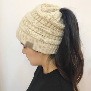 Femmes Stretch Tricot Épais Chapeau désordonné Chignon queue de cheval Beanie hiver chaud Trou Ski Cap