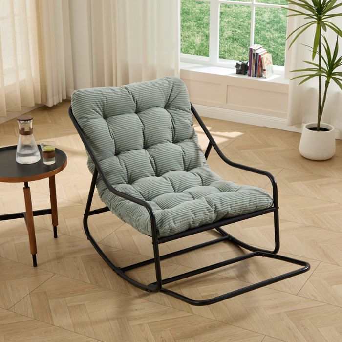 Fauteuil a bascule dexterieur en acier noir avec coussin epais vert clair 75 x 116 x 82 cm
