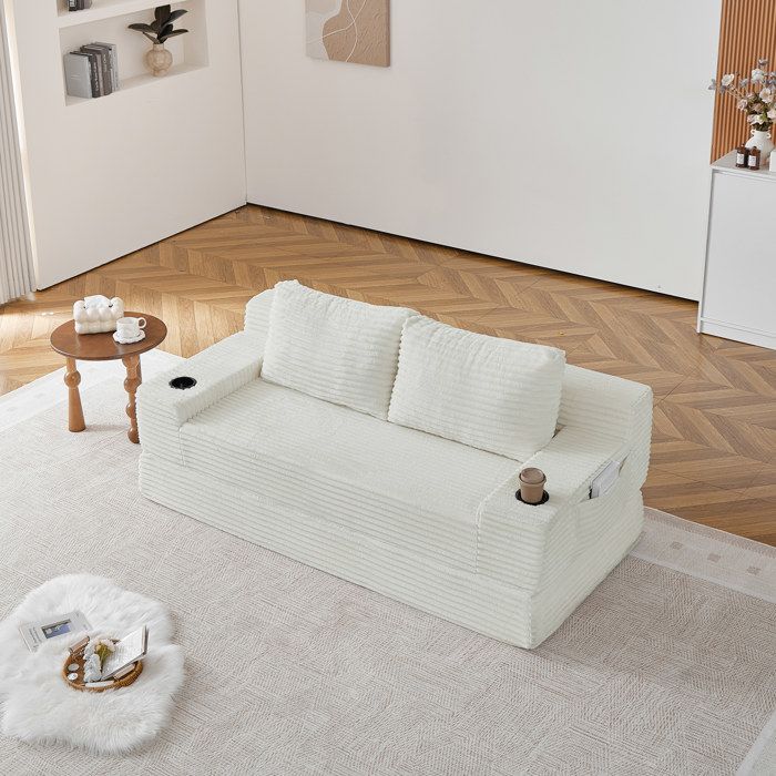 Canapé convertible 2 places coloris beige revêtement en velours côtelé avec rangement avec coussins avec accoudoirs