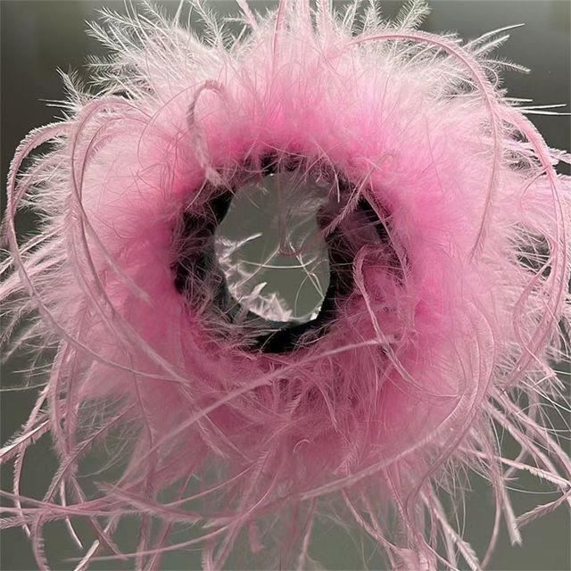Claquette plume 2025