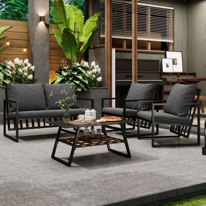 Salon de jardin 4 places - canapé, 2 fauteuils et 1 table basse avec étagère - tube en acier galvanisé et PVC - Noir
