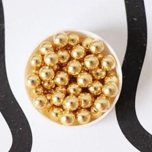 Mélange de perles dorées en forme d'étoile, de cœur et de sucre
