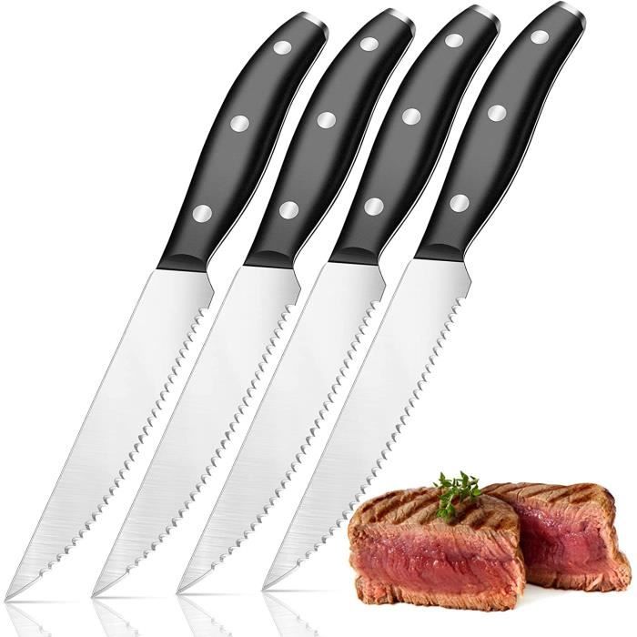 Un Steak Avec Un Couteau Et Un Couteau Sur La Table