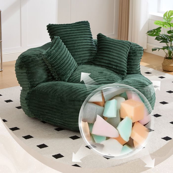 Fauteuil poire 1 place vert émeraude en velours côtelé dossier haut accoudoirs et 3 coussins