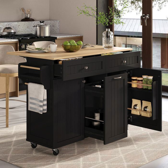 Îlot de cuisine mobile 140×40/70×92 cm double porte trois tiroirs buffet haut avec espace repas extensible noir.