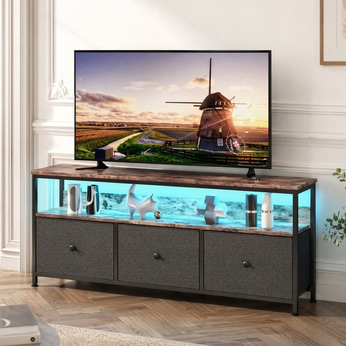 Meuble TV Noir avec LED SORVAGLOS137 x 298 x 57 cmArmoire TV de salon en Bois 3 tiroirs en tissu et structure en métal