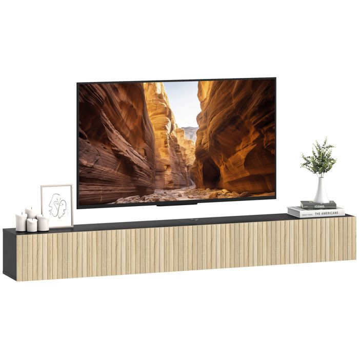 Meuble TV suspendu - HOMCOM - pour téléviseur 72 pouces - 2 portes cannelées rabattables - MDF - 140x25x22cm - bois naturel et noir Meuble TV suspendu - HOMCOM - pour téléviseur 72 pouces - 2 portes cannelées rabattables - MDF - 140x25x22cm - bois naturel et noir