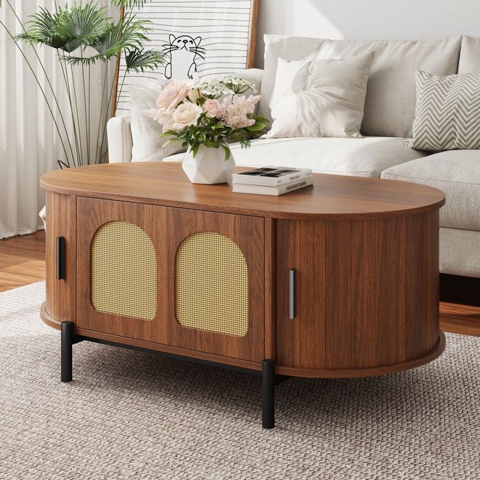 Table basse ovale 100x50x40 cm avec portes coulissantes en rotin rangement aspect bois pieds métal - MDF - Noyer