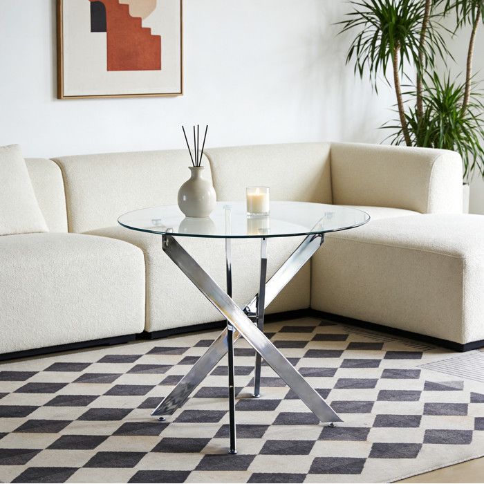 Table à manger ronde en verre avec pieds croisés en métal argenté