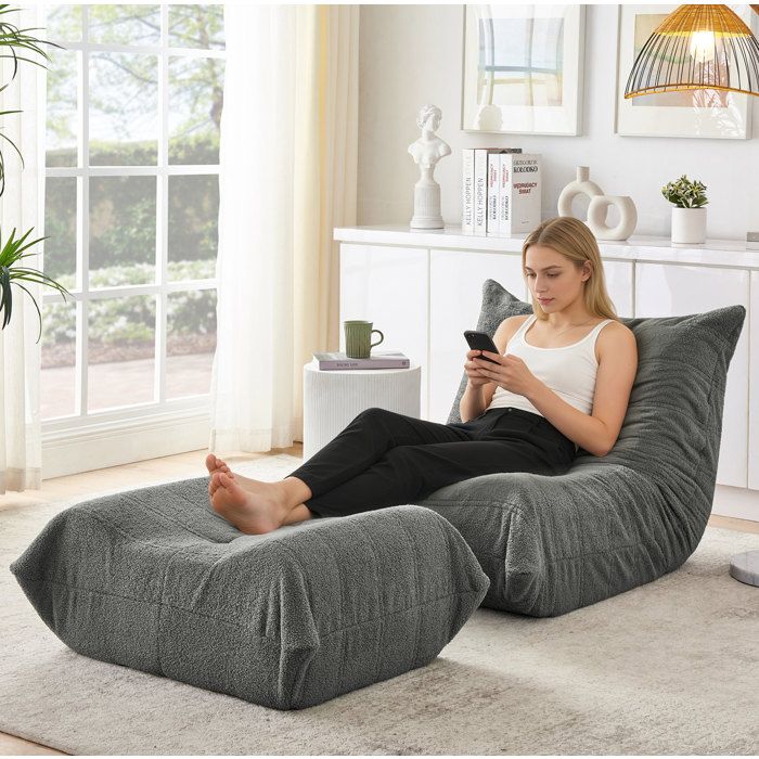 ROVRYN Chauffeuse de sol 1 place avec repose-pieds tissu teddy gris mousse sans montage