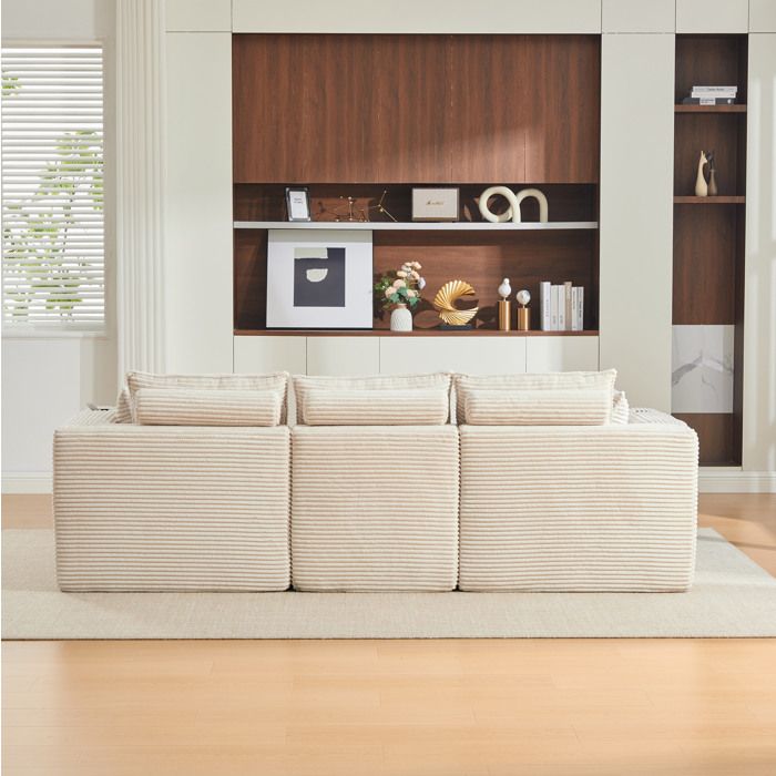 Ensemble canapé 3 places modulable beige + pouf équipé de coussins porte-verres et poches latérales