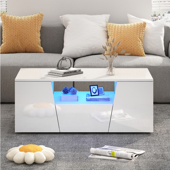 Table basse blanche brillante avec LED 2 placards 1 tiroir et niche centrale