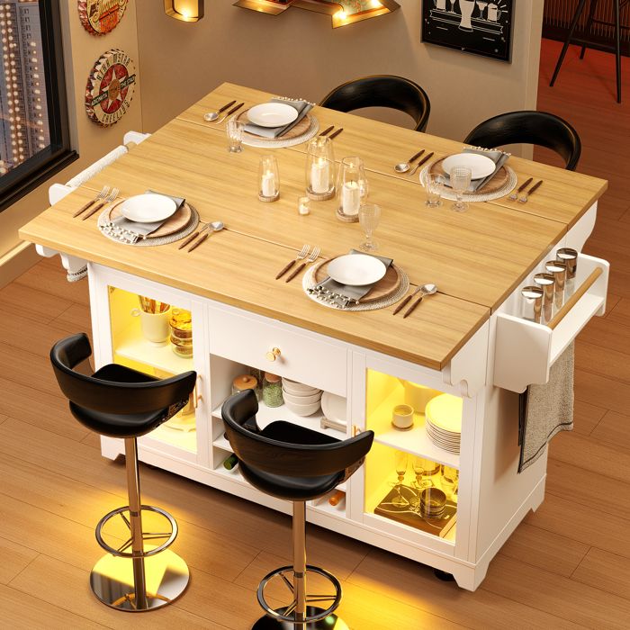 Îlot de cuisine avec éclairage LED plateau rabattable portes vitrées roulettes et étagères ouvertes 120×40–80×95 cm blanc.