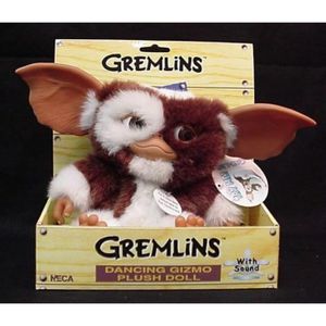 Peluche Gizmo qui chante et qui danse  Ne pas oublier de respecter les  règles lorsqu'on a un mogwaï à la maison : - Ne pas l'exposer à la lumière  (notamment celle