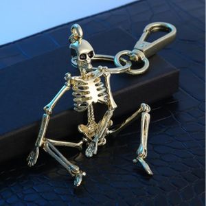 SODIAL R Porte-cles Pendentif crane en moto Decoration cool
