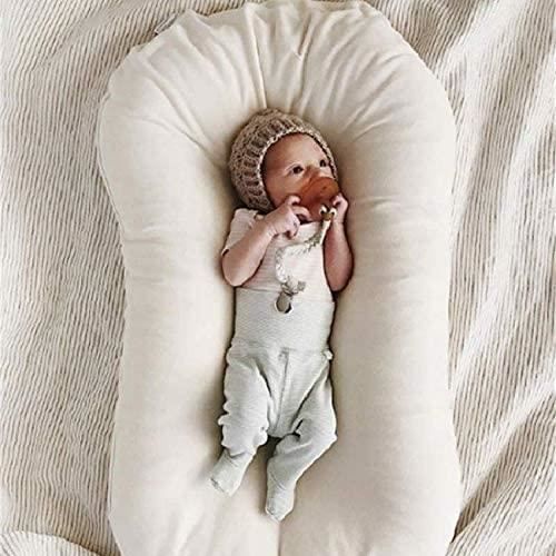 Un nid bébé réducteur de lit, pour renforcer le sentiment de sécurité