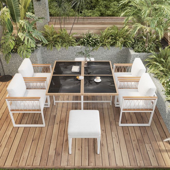 Ensemble salon de jardin 7 pièces 1 table en verre trempé 4 chaises en rotin marron et 2 repose-pieds dossier déhoussables