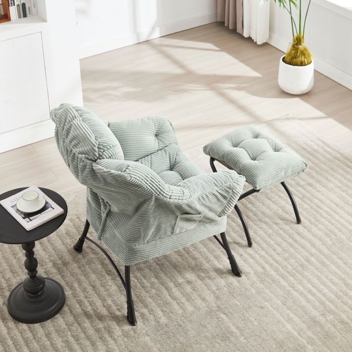 Chaise ottoman assorti accoudoirs poche latérale repose-pieds revêtement rembourré vert clair style lounge moderne