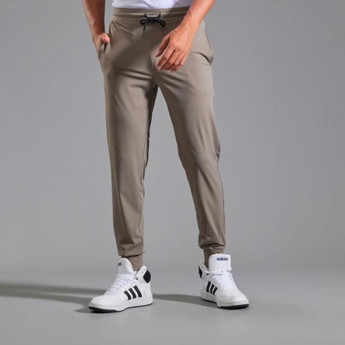 SHEKINI Pantalon Jogging Unisexe - Sport & Loisirs - Poches Zippées - Tissu Stretch 4 Sens - Confort Ultime