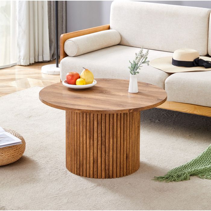 Table basse ronde effet bois avec base cannelée et structure en métal