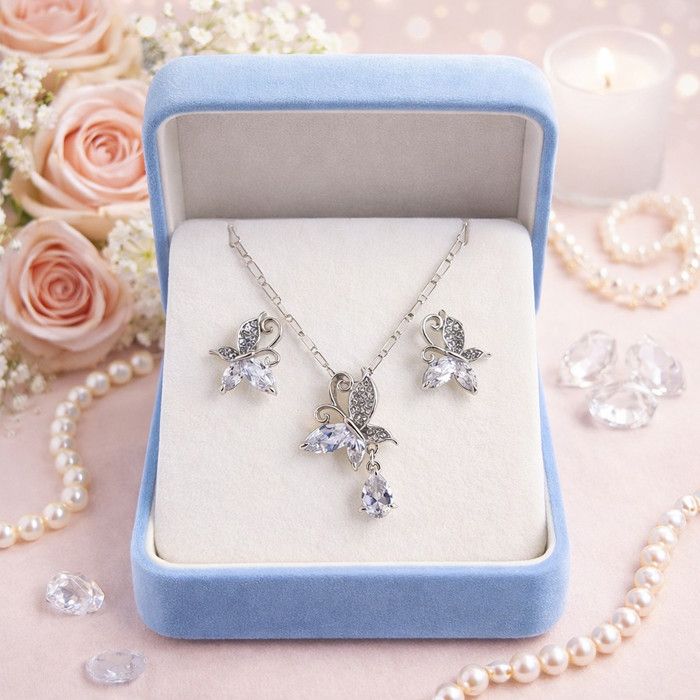 Parure papillon argentée avec oxydes de zirconium