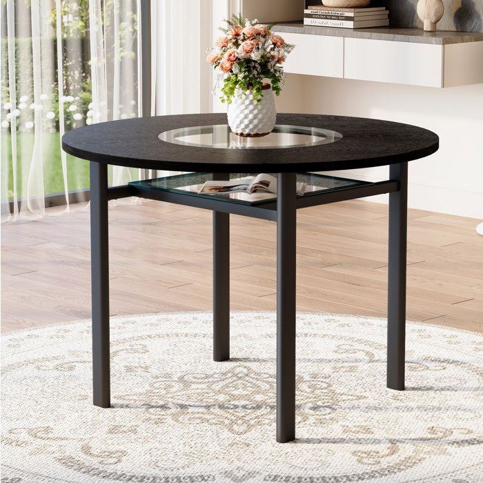 Table à manger ronde 100 cm noir effet bois avec insert en verre gris étagère verre et pieds métal ORVRYN