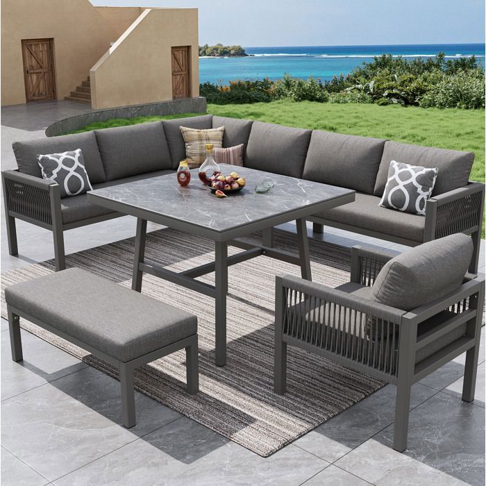 Salon de jardin 8 places avec canapé 6 places en tissu 1 fauteuil 1 banc 1 table en verre effet marbre gris
