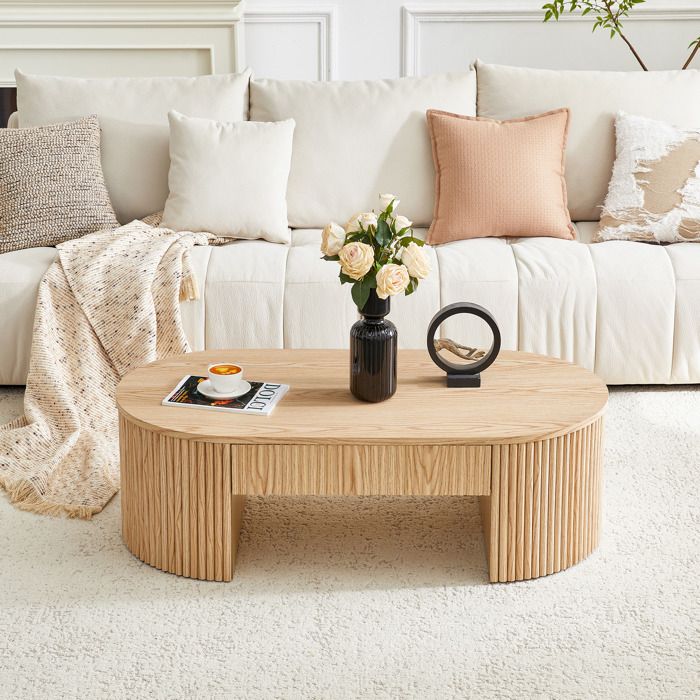 Table basse ovale en bois - Aspect chêne clair - Tiroir extensible - Revêtement cannelé - Dimensions 105x54x38 cm