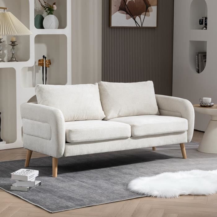 meubles cosy canapé 2 places en tissu beige style scandinave assises larges profondes accoudoirs courbés piètement effilé bois