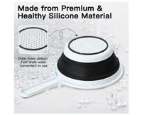 Passoir pliable en silicone avec poignées 26x11cm Noir | Maisons du Monde Passoir pliable en silicone avec poignées 26x11cm Noir | Maisons du Monde