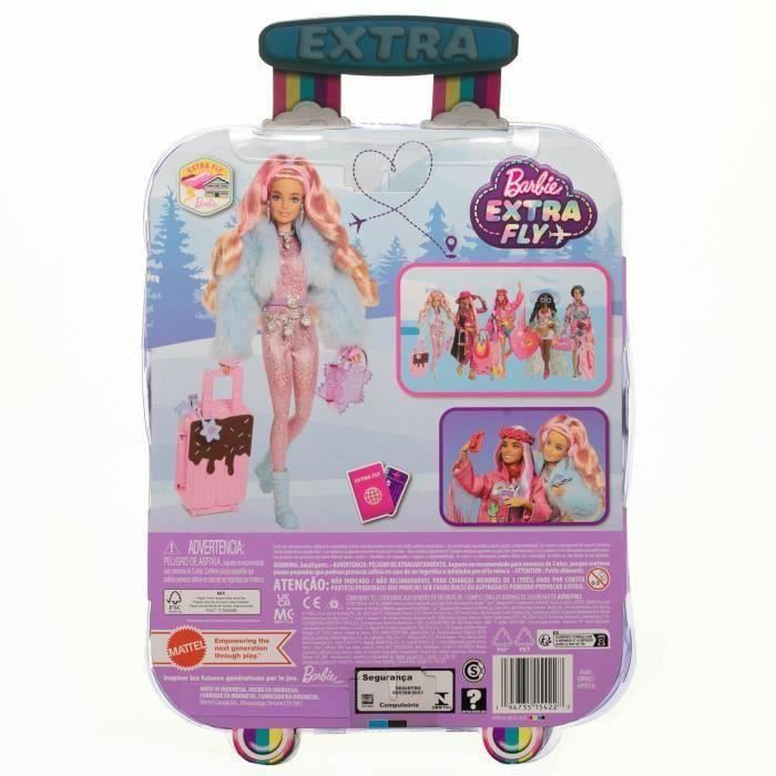 La poup e est habill e pour partir a la neige. Barbie emporte 15