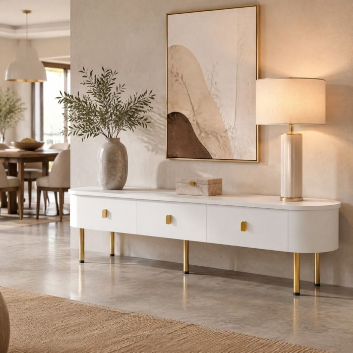 Meuble TV Lowboard avec 3 tiroirs poignées dorées et pieds dorés bords arrondis pour salon MDF blanc et or 174 cm - UVRION