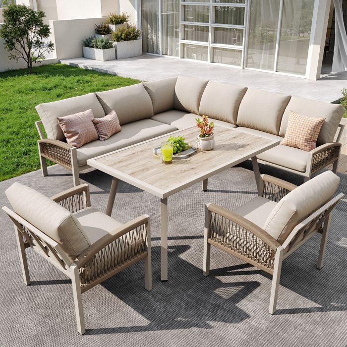 Canapé de jardin en L pour 8 personnes structure en fer coussins beiges 1 table en verre et 2 fauteuils tissés main