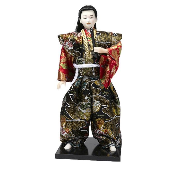 Poupée dans la pure tradition japonaise, revêtue de son kimono mauve