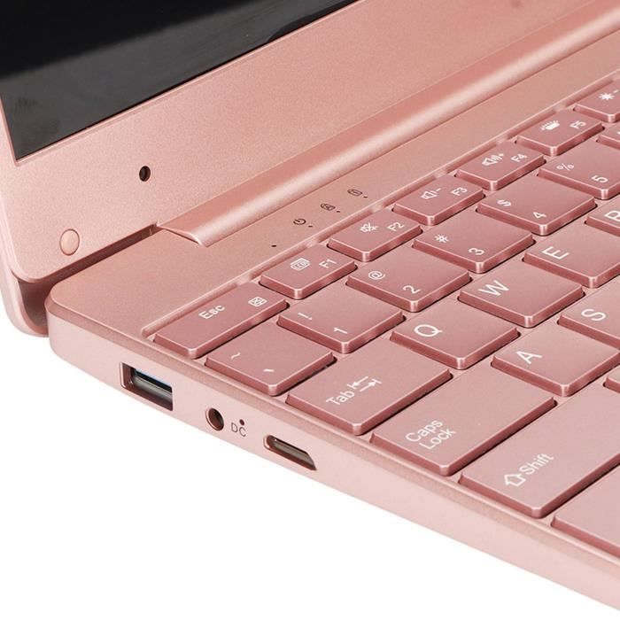 ordinateur portable rose dans une chambre bleue avec une