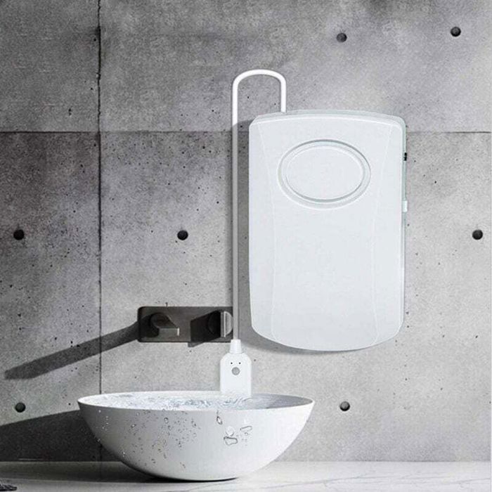 Remote water sensor positioned in a hidden plumbing area