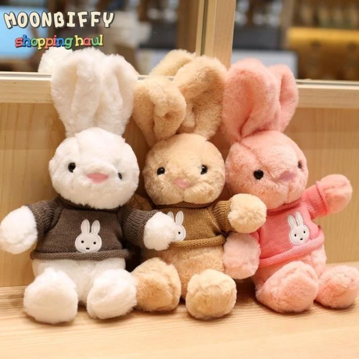 Lapin en peluche à longues oreilles, gros lapin mignon jouant avec une