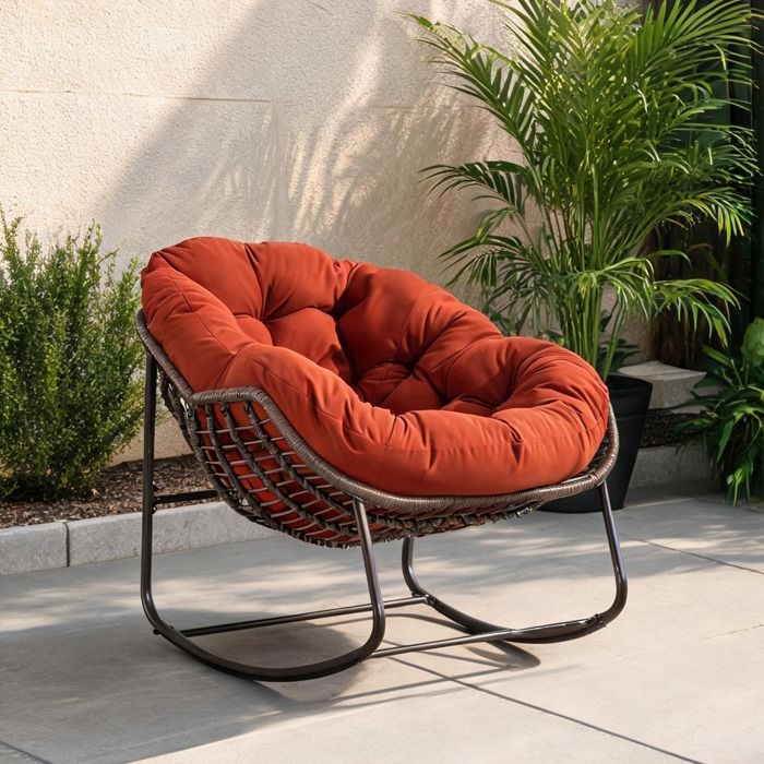 Fauteuil à bascule en rotin synthétique orange-toned structure acier pour véranda et salon