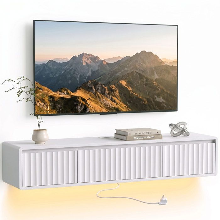 Meuble TV suspendu - HOMCOM - lumières LED et prises - pour 65 pouces - porte cannelée et 2 tiroirs - bois - 120x29 5x23 5cm - blanc Meuble TV suspendu - HOMCOM - lumières LED et prises - pour 65 pouces - porte cannelée et 2 tiroirs - bois - 120x29 5x23 5cm - blanc