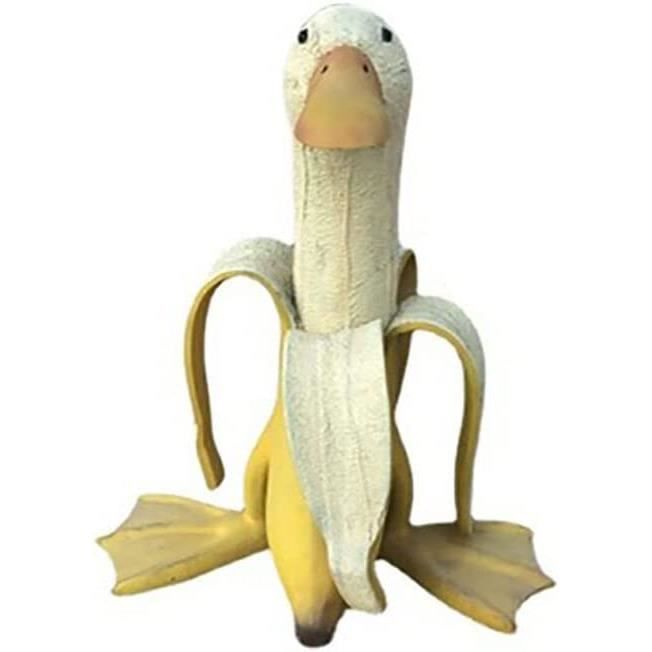 Drôle doux pelé banane canard jouet avec des jambes d'animaux portant rouge chap Drôle doux pelé banane canard jouet avec des jambes d'animaux portant rouge chap