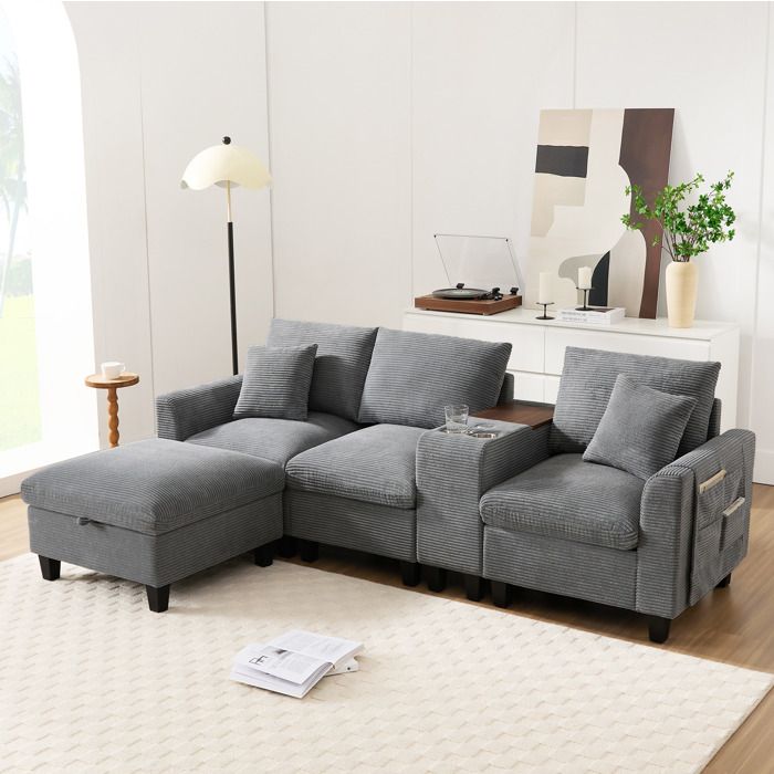 Canapé dangle modulable en L 4 places gris avec console USB porte-gobelets et pouf coffre
