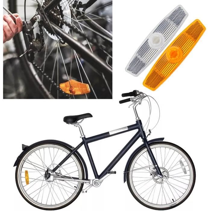 Un Vélo Avec Des Jantes Orange Et Un Réflecteur Blanc.