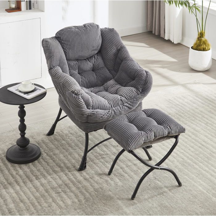 Fauteuil lounge avec ottoman et accoudoirs. poche latérale. dossier ergonomique. cadre acier. gris