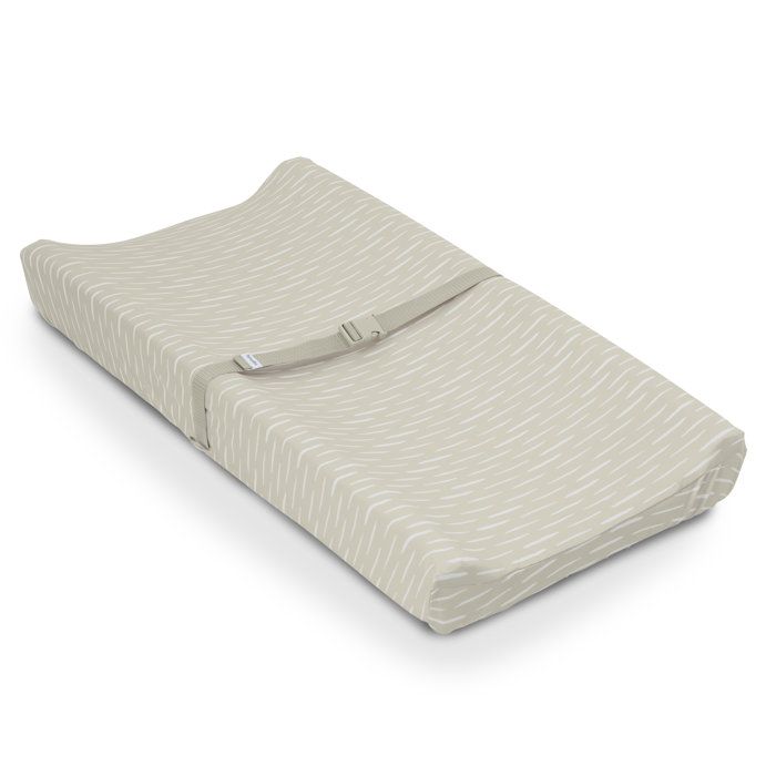 INGENUITY- Matelas à langer beige à contour réhaussé et harnais de sécurité déhoussable