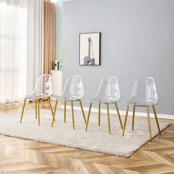 Lot de 4 chaises de salle à manger transparentes. Pieds en métal doré stables et antidérapantes. Design moderne pour salon.