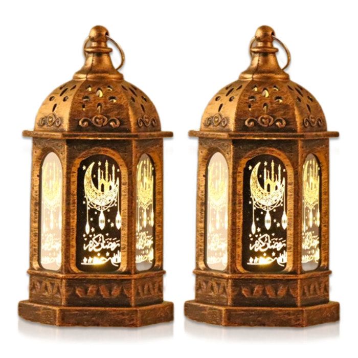 Deux lanternes hexagonales imprimées de couleur bronze idéales pour décorer une table à manger.