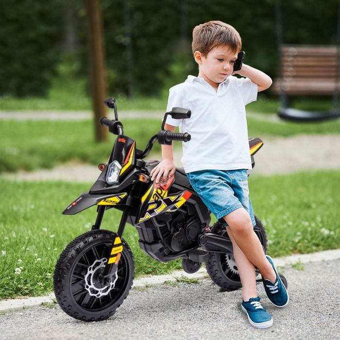 Moto électrique 12V pour enfants avec stabilisateurs lumières LED musique port USB jaune. Convient aux garçons et aux filles.